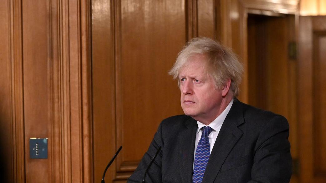 Boris Johnson at the podium at a Downing Street press conference in February 2021.