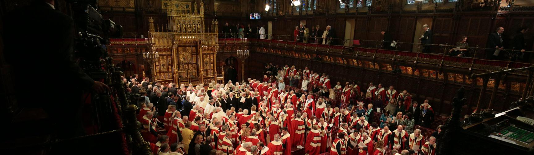 Members of the House of Lords and guests leave the chamber following the State Opening of Parliament by Queen Elizabeth II