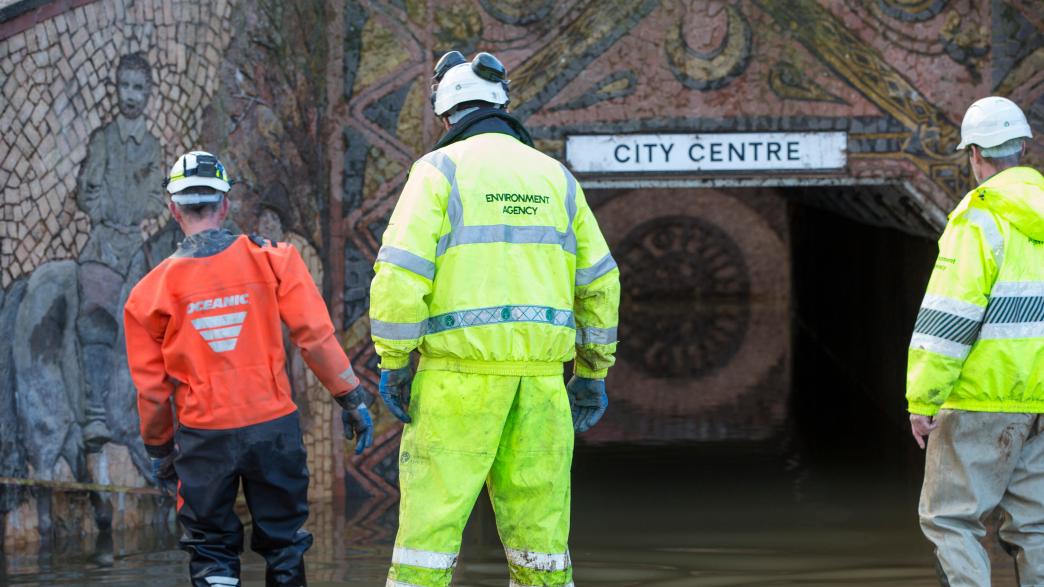 Environment Agency workers pumping water after a flood.
